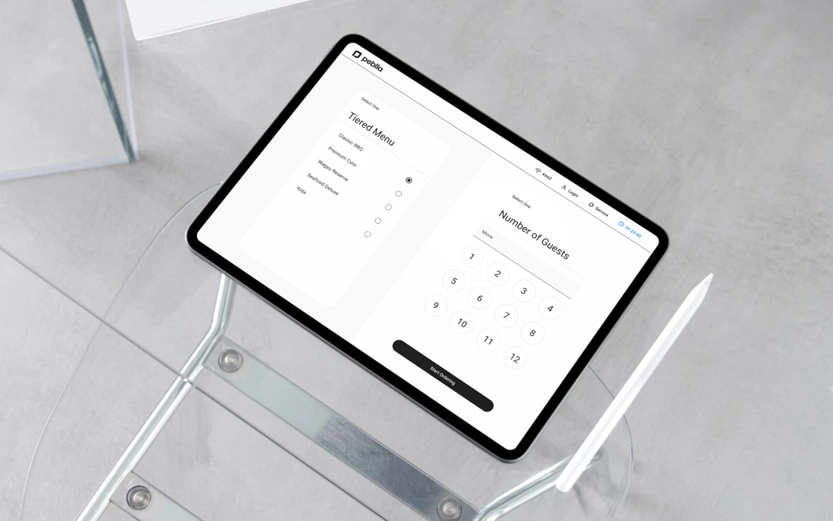 The Ordering Tablet on a table &mdash; a guest picks their all-you-can-eat tier and party size before ordering starts